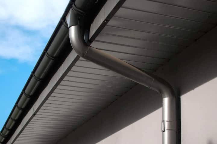 Corrosion-resistant galvanized gutters installed on a commercial building in Katy